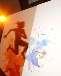 Capture the essence of warm golden hour light with dynamic motion and vibrant watercolor splashes on paper. Explore blurred l