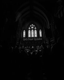 A high-contrast, low-key monochrome image depicts a magical school teeming with young wizards. Rendered in intense jet black 
