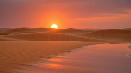 Experience an adorable and charming sunset scene at the edge of a desert adorned with golden dunes, where gentle drizzling ra