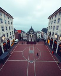 Capture the essence of an empty town square, divided into distinct sections illuminated by creative light art and bold abstra