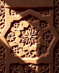 This artwork features intricate Islamic geometric patterns carved in stone, rendered in a modern flat design aesthetic with s
