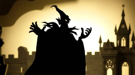This striking image features a layered papier-mâché silhouette of a classic Disney villain, dramatically casting a spell with