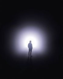 A person stands at the tunnel's edge, captivated by the gentle, soft light emanating from within. The scene exudes a dreamy a