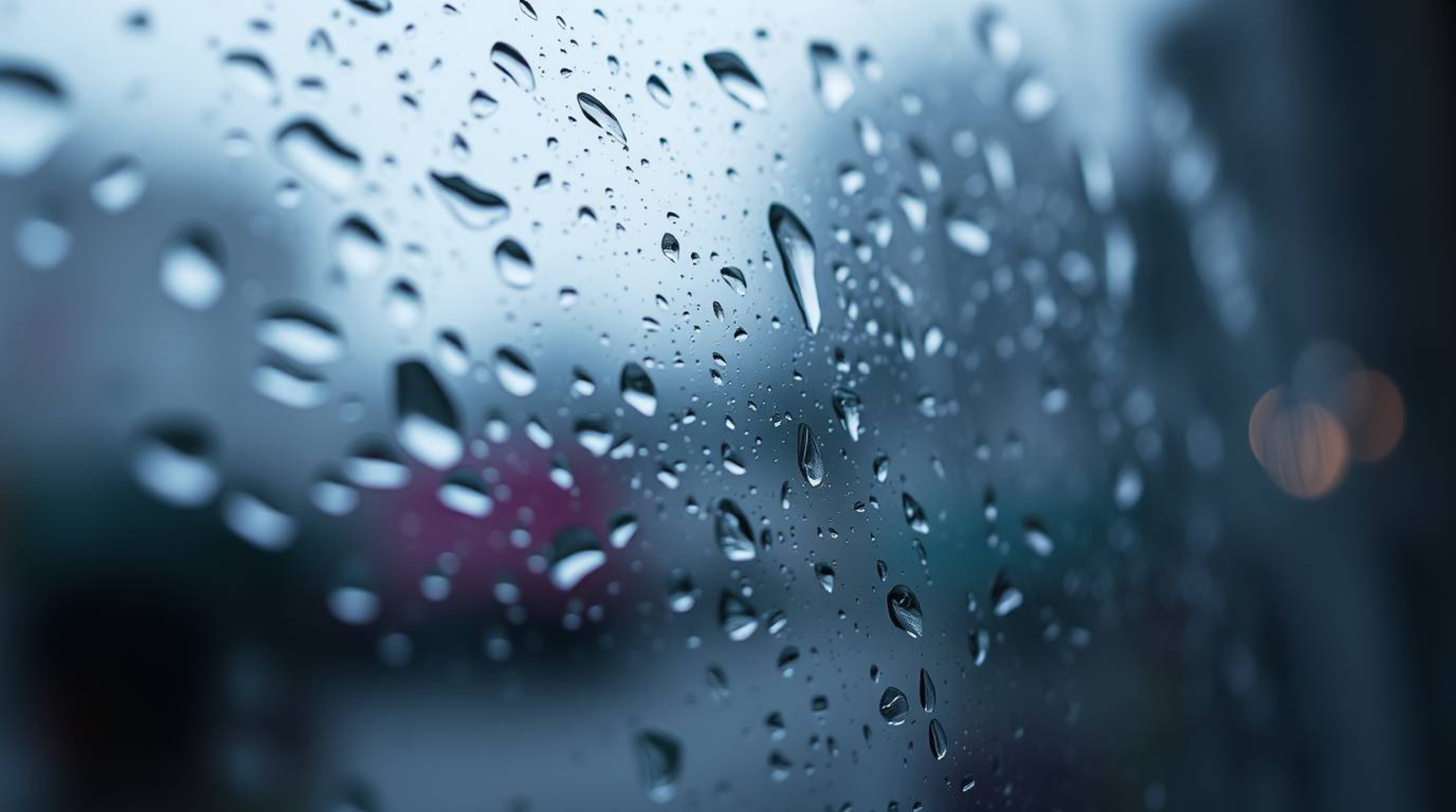 A tight close-up shot captures a wet and rainy scene featuring a glass object reflecting smooth gradient textures under a dri