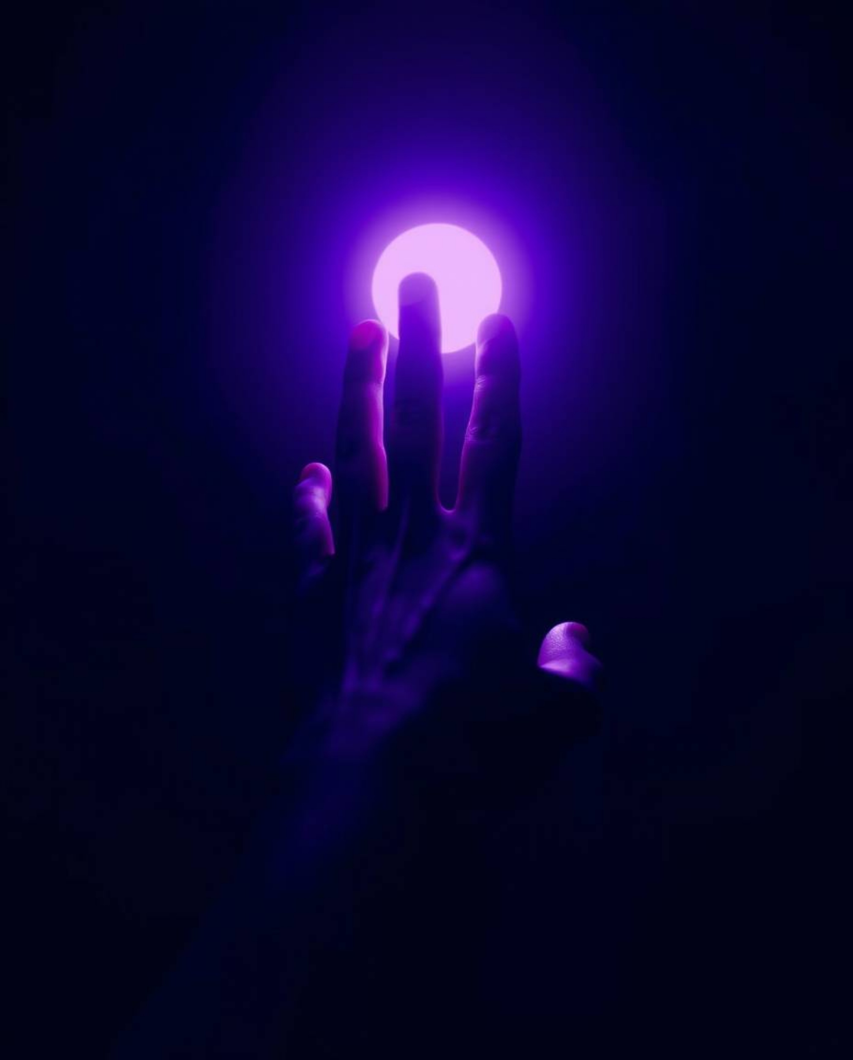 A captivating fine art photograph showcasing a hand reaching towards light from the depths of darkness. The image is rendered