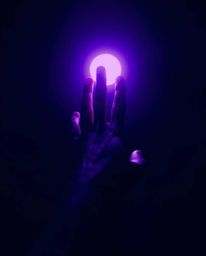 A captivating fine art photograph showcasing a hand reaching towards light from the depths of darkness. The image is rendered