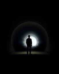 A high-resolution stock photo depicts a person standing at a tunnel's edge, gazing towards a light source. The image boasts a