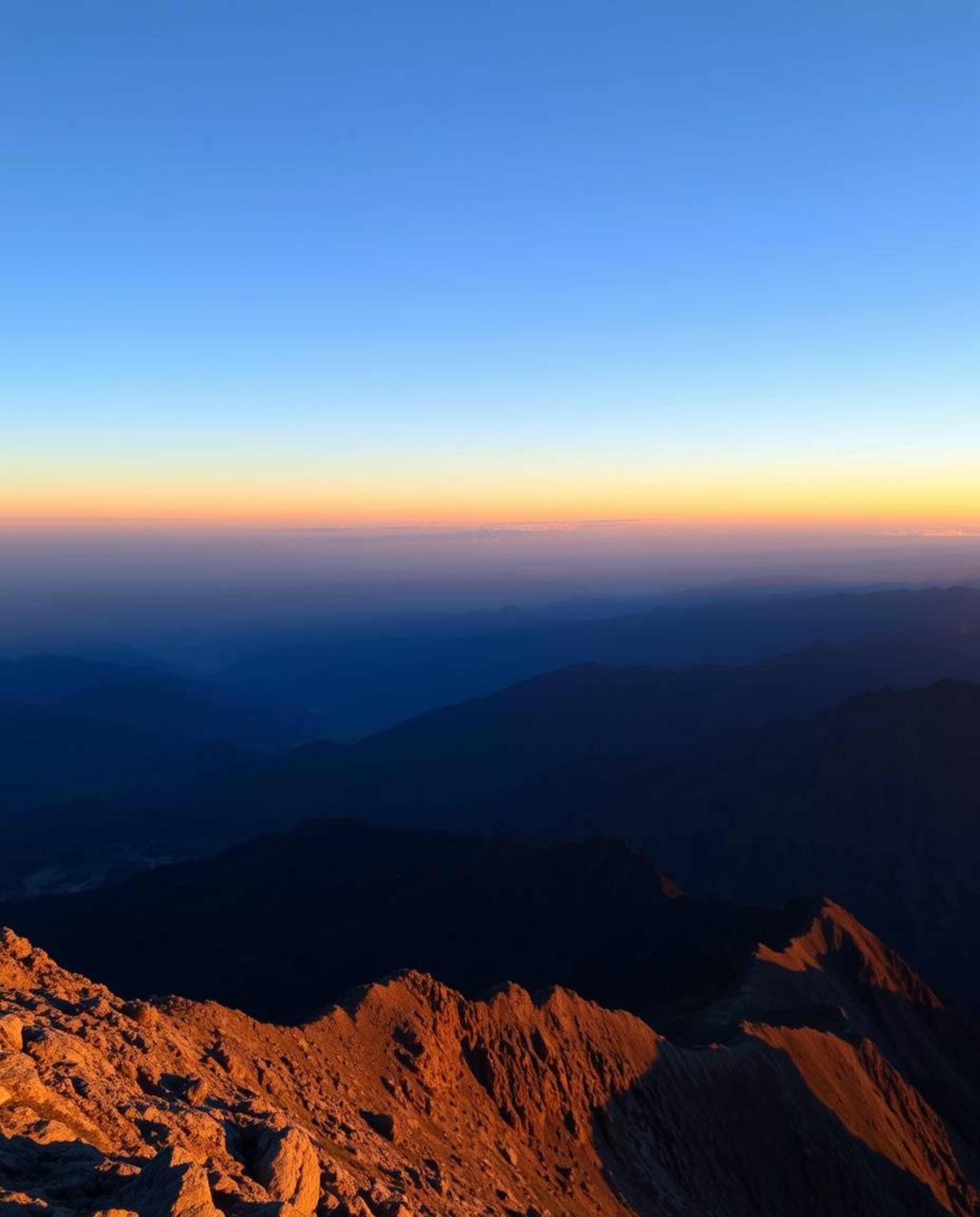 Experience a serene atmosphere with a view of a sunset from a high alpine peak, painted in a palette of cool blues, greens, a