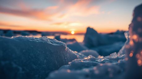 Experience an extreme macro close-up of a mystic and enchanting sunset painting the icy polar glaciers. This dreamlike scene 