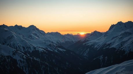 Capture the breathtaking beauty of snow-covered mountains illuminated by a pastel sunset, utilizing high-contrast, low-key li