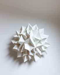 Explore a captivating high-angle view featuring intricate origami-style 3D sculptural forms.  Fluid mercury shapes and reflec