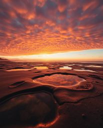 A warm autumnal high-angle perspective photograph, taken from an elevated viewpoint, depicts a beautiful sunset sky mirrored 
