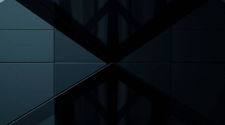 This captivating architectural photograph showcases a glass object reflecting smooth gradient textures with remarkable precis