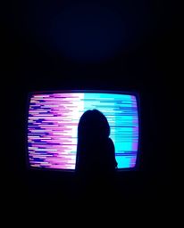 A captivating image showcasing a silhouetted figure set against a vibrant, glitch-filled TV screen. The retro aesthetic is am