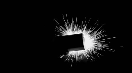 Experience a classic exploding TNT gag set in the wild west, rendered in a striking, jet-black, tight close-up shot. This int
