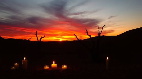 Experience the magic of a cozy desert sunset scene bathed in warm candlelight.  Imagine warm autumn colors, earthy tones, and