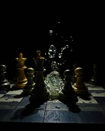 A stunning artwork depicting a chessboard frozen mid-destruction, rendered in a strong and moody style. The piece utilizes co