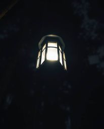 A captivating scene unfolds with a low-angle perspective and dramatic lighting, highlighting a glowing lantern piercing the d
