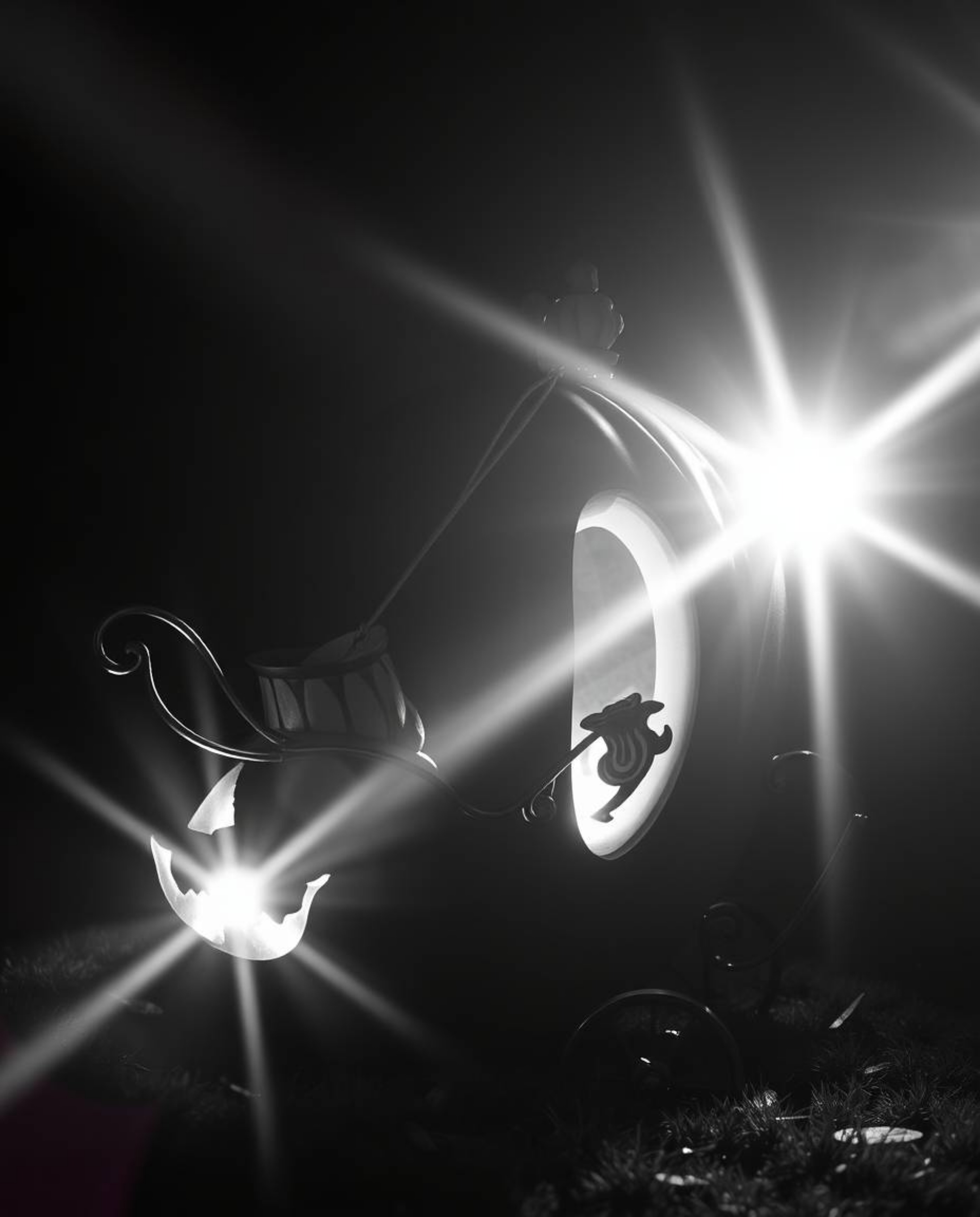A captivating classic black and white image depicts a magical pumpkin transforming into an elegant carriage.  Bright lens fla