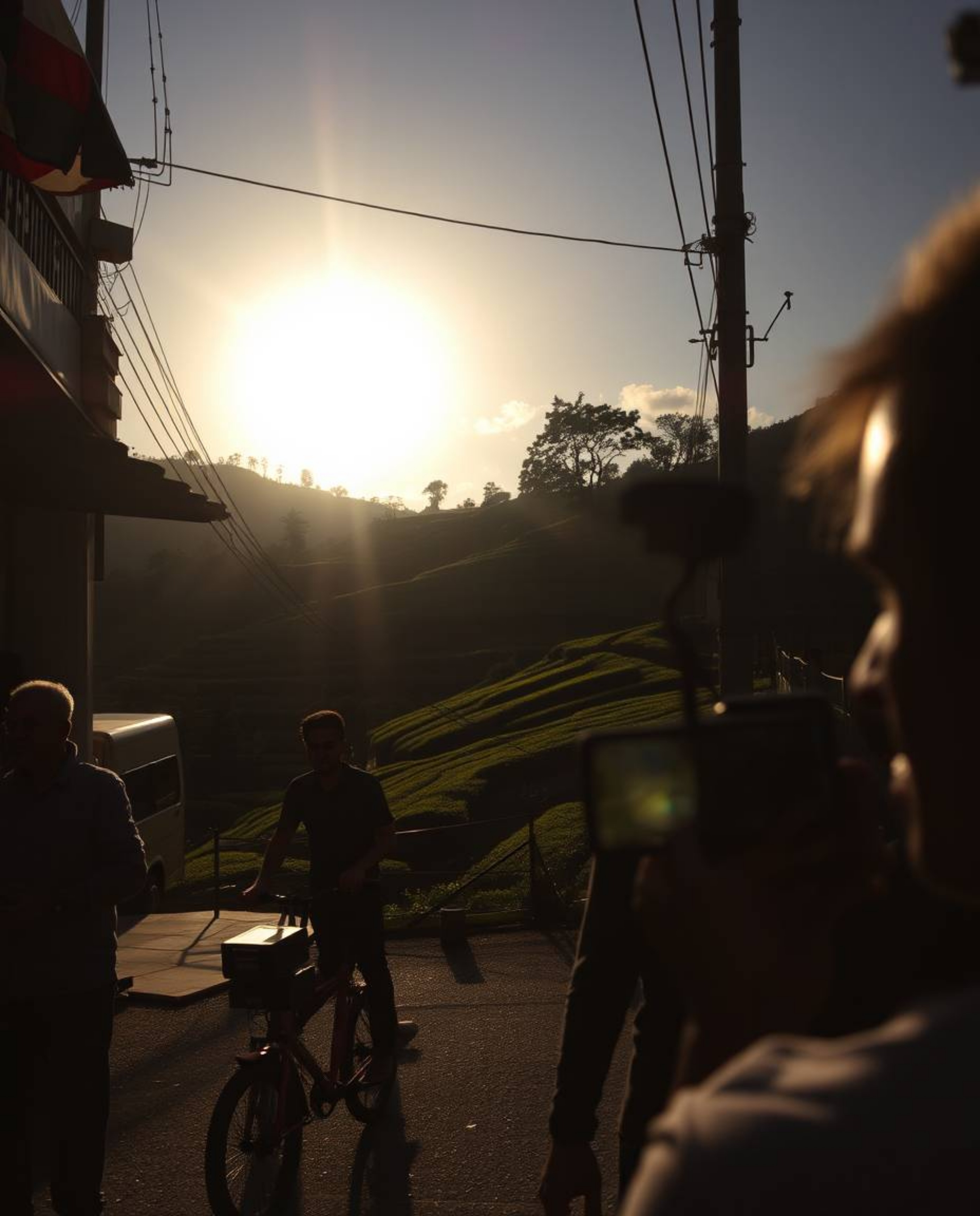 Candid street photography captures a sunset over terraced tea plantations, blending urban scenes with natural beauty. The ima