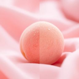 Immerse yourself in the soothing visuals of this distinct split close-up ASMR image. A soft, blushing pink peach rests delica