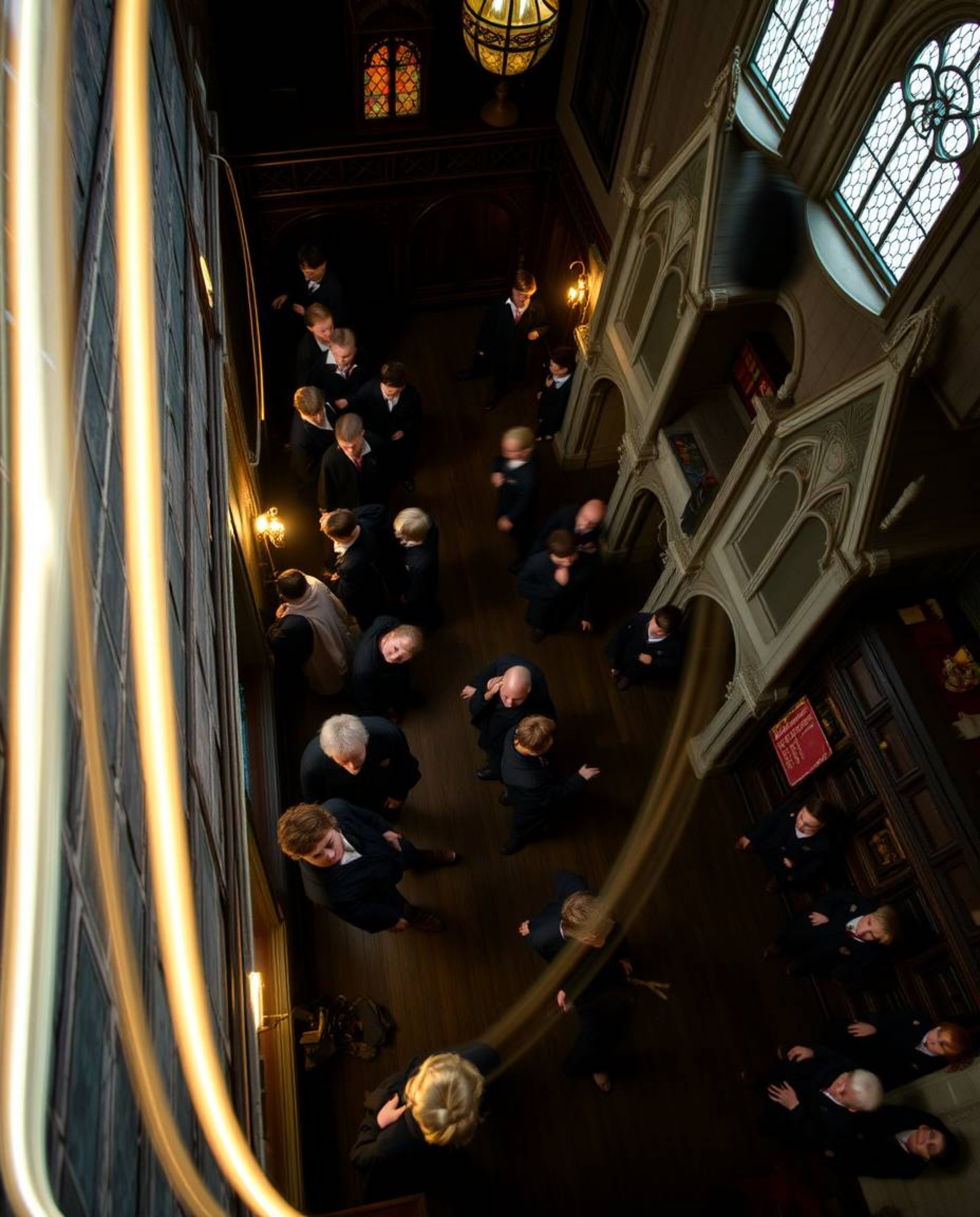Experience the enchanting world of a magical school teeming with young wizards, captured through stunning long exposure photo
