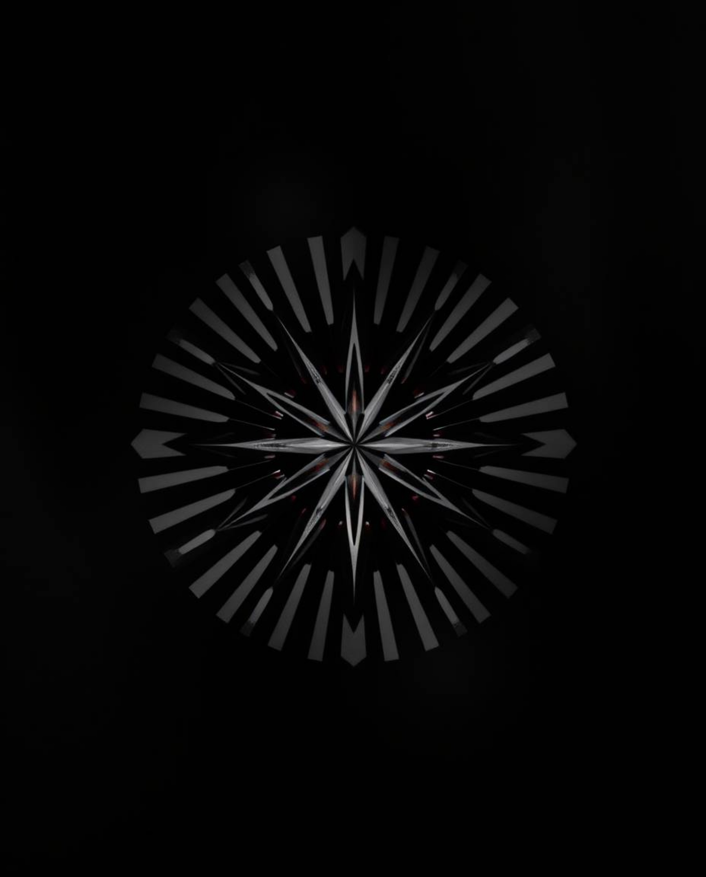 Explore the captivating world of geometric optical illusions with this collection of black and white images. Featuring retro-