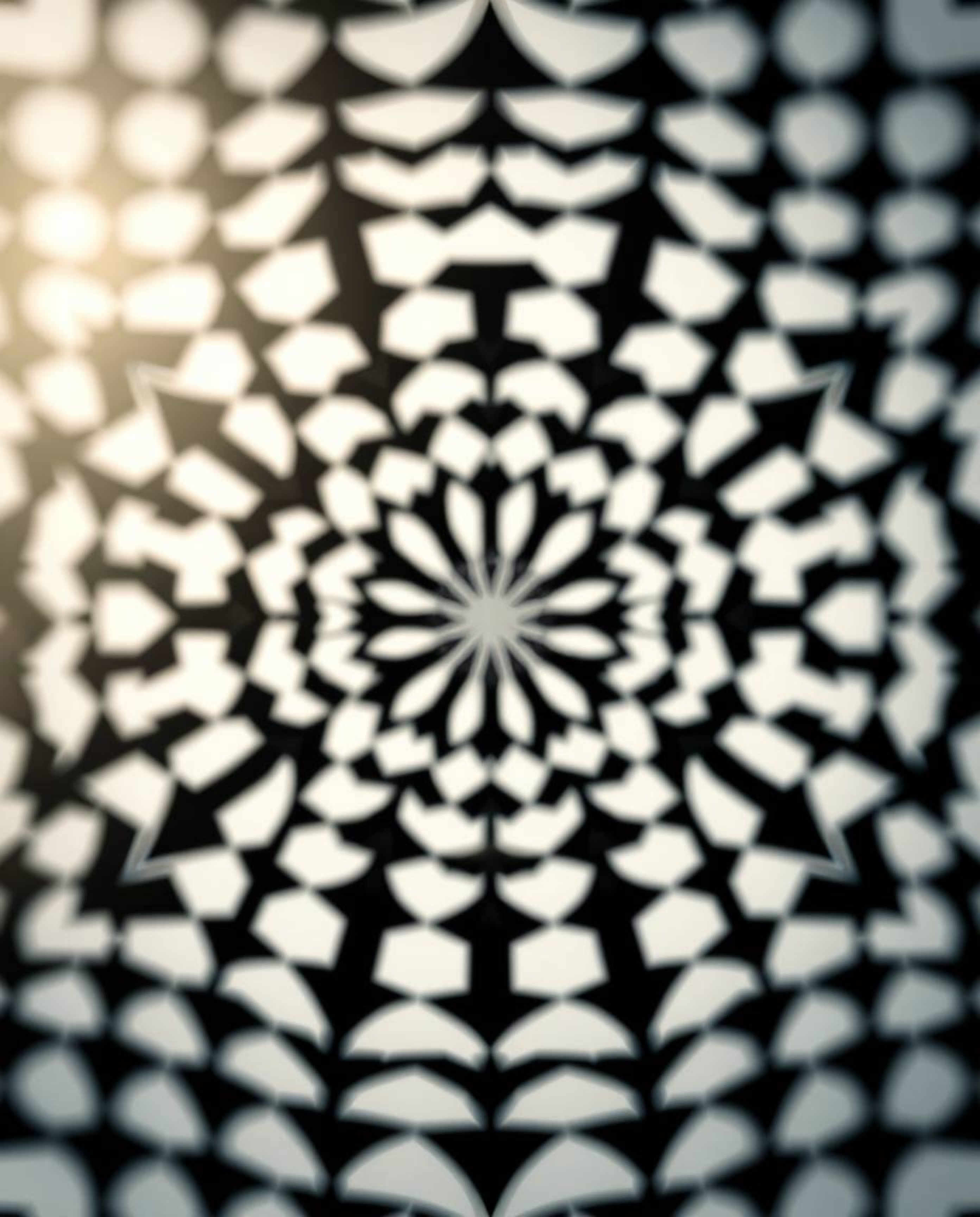 Explore the mesmerizing world of black and white geometric patterns in an optical illusion style, reminiscent of retro vibes.