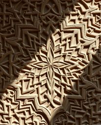 Explore the beauty of intricate Islamic geometric patterns carved in stone, reminiscent of origami.  These designs showcase r