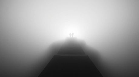 High-angle view black and white photograph featuring steps of light ascending into a foggy sky, creating a dreamlike and peac