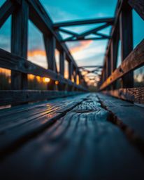 This macro photograph offers an extreme close-up view of a small subject detail on an old wooden bridge over a river at sunse