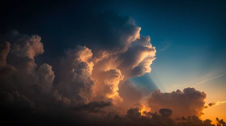 Experience the ethereal and spiritual vibe of a thunderstorm illuminated by the warm hues of a sunset. This image captures th