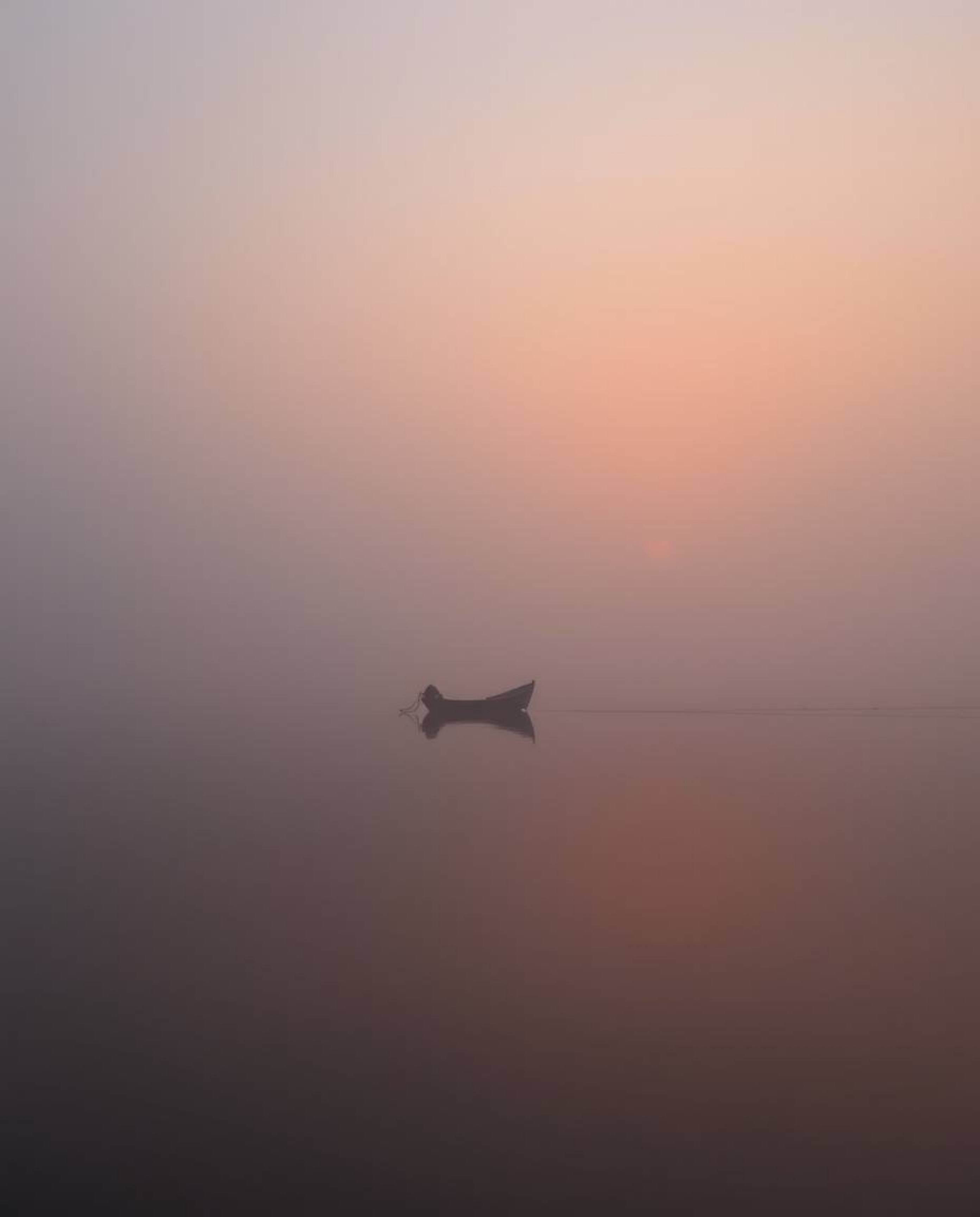 A boat gently floats on a lake during sunset, shrouded in thick fog, smooth gradient transitions depict a seamless blending o