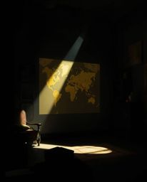 Experience the captivating ambiance of chiaroscuro lighting, where strong contrasts and deep shadows accentuate a glowing map