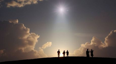 A silhouetted image showcases iridescent colors and backlighting, highlighting light steps ascending into a cloudy sky. Angel