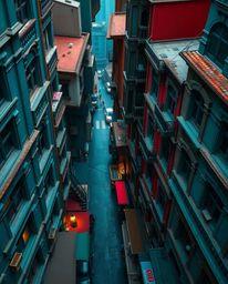 Experience a captivating surreal street scene where buildings fold and twist in a mesmerizing high-angle perspective.  The ri