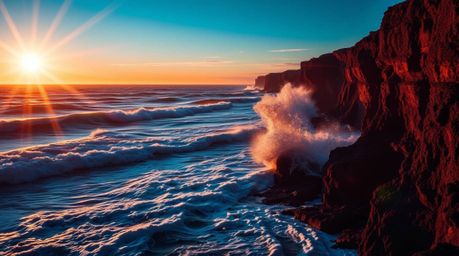 A captivating image showcasing waves crashing against dramatic cliffs at sunset.  The photograph features a striking lens fla