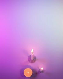 A captivating bird's-eye view scene bathed in the warm glow of candlelight, featuring a soft gradient texture blending pink, 