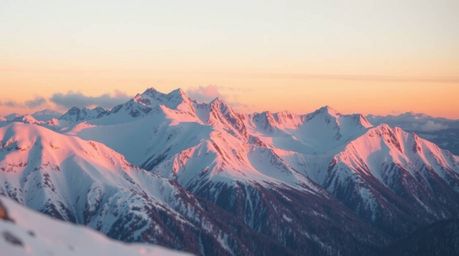 A soft pastel, unusual, and original fine art photograph capturing a tight close-up of snow-covered mountains glowing under a