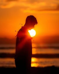 This vibrant artwork captures the essence of the golden hour, showcasing a human silhouette ingeniously formed from a dynamic