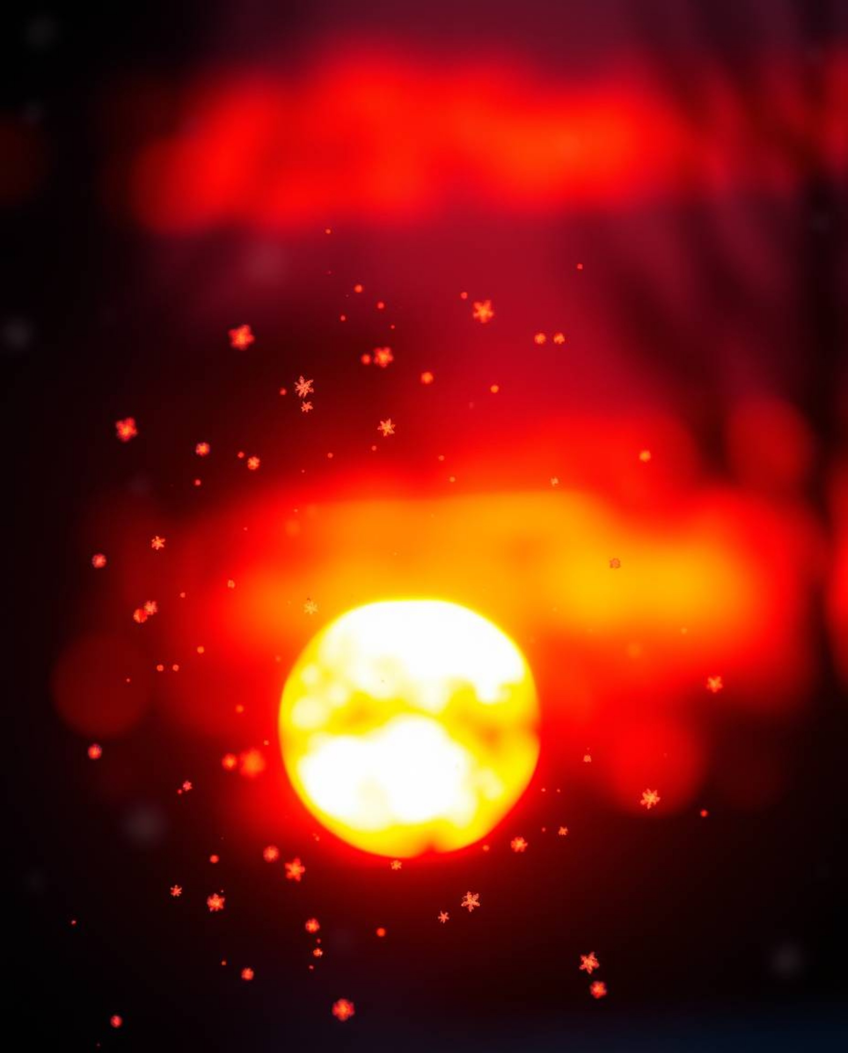 This creative light art piece depicts snowflakes falling during a vibrant sunset, defined by its use of dramatic cinematic li