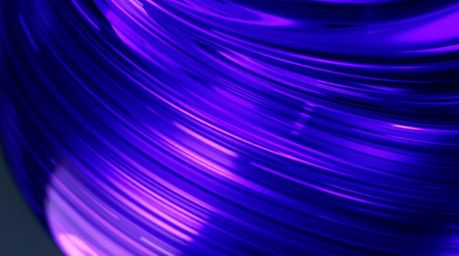 This image showcases a close-up detail of a glass object reflecting smooth gradient textures, bathed in deep ultraviolet hues