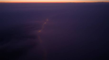 Experience the ethereal beauty of a river delta bathed in the soft glow of twilight. This high-angle perspective captures the
