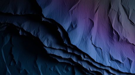Explore the dramatic interplay of high contrast and low-key lighting on a layered papier-mâché creation. Inspired by the mes
