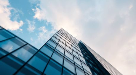 This captivating image showcases an extreme macro close-up of a modern glass building seamlessly dissolving into a soft, clou
