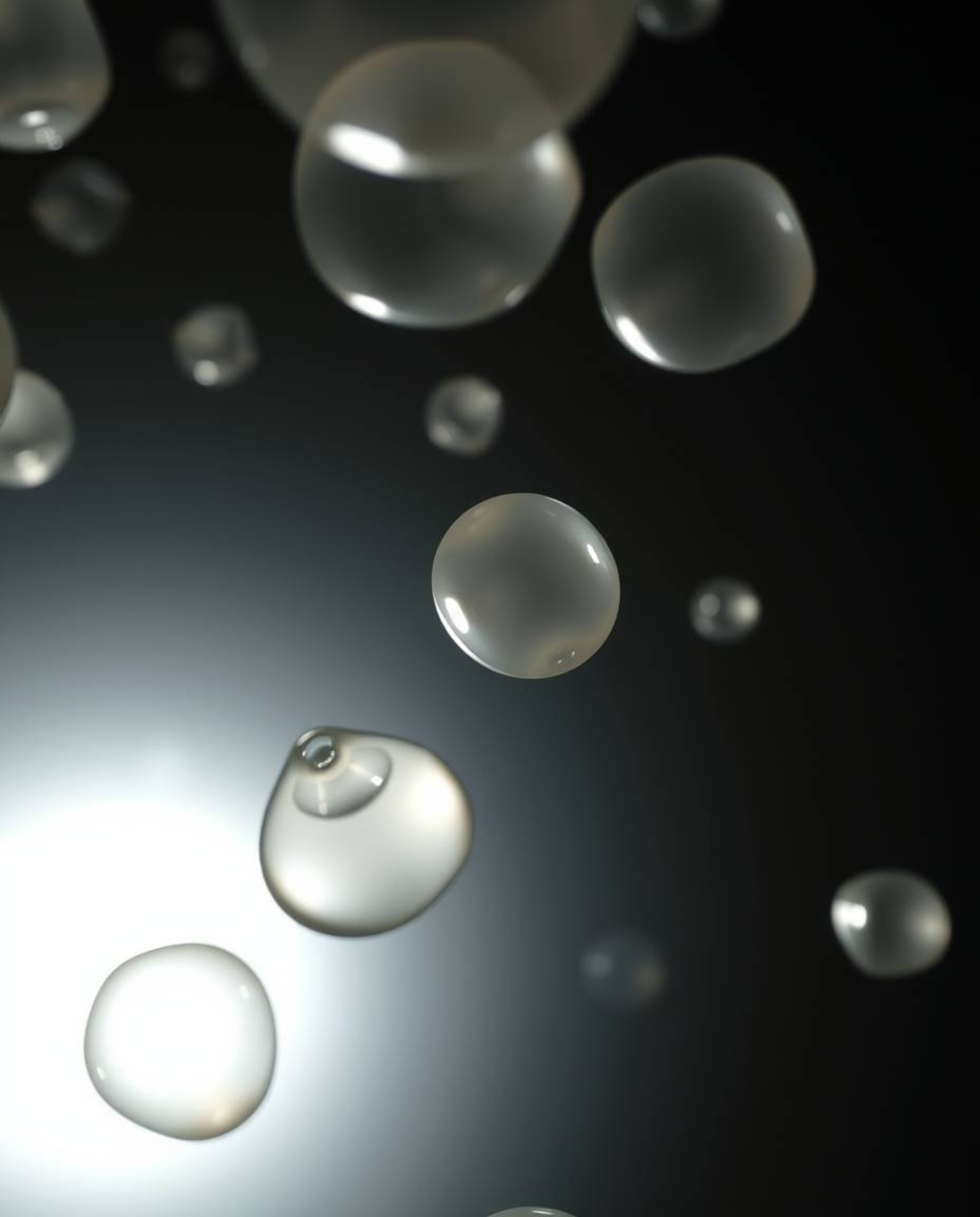 Explore stunning 3D renders featuring translucent fluid organic blobs gracefully floating in space. These tight close-up shot