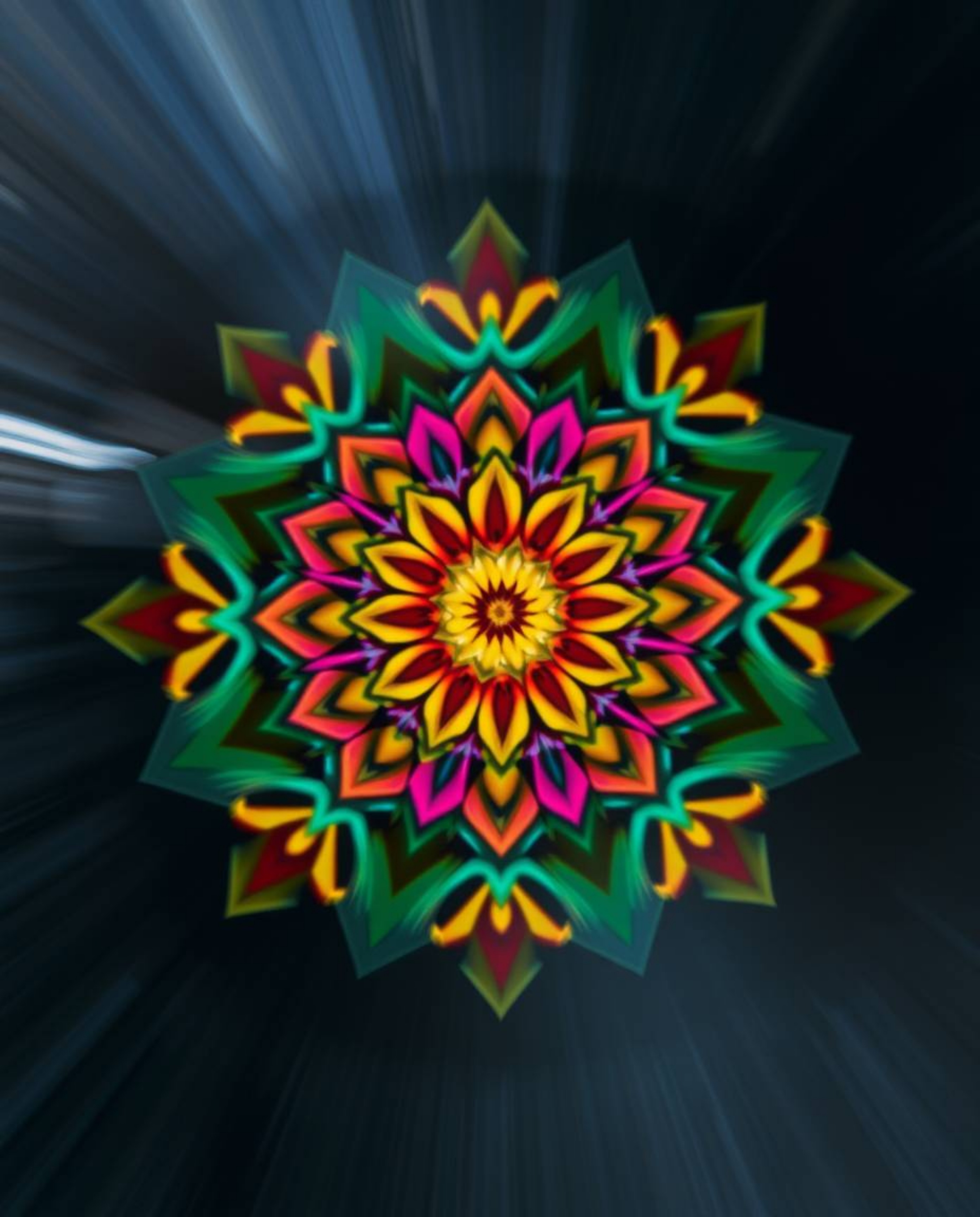 This stunning long exposure photograph captures a geometric floral mandala in vibrant colors. The symmetrical design showcase