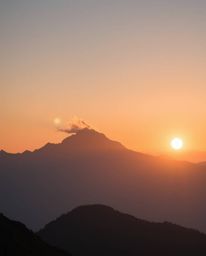 Experience an ethereal and spiritual vibe with this depiction of a sunset from a high alpine peak. The scene is imbued with a