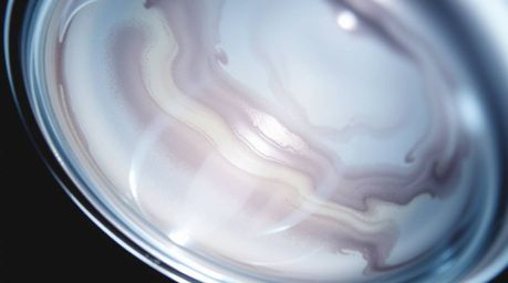 Explore the captivating details of a delicate watercolor painting featuring a glass object reflecting smooth gradient texture