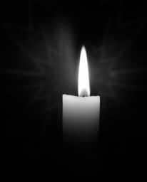 Capture the essence of a dreamy atmosphere with warm candlelight illuminating a black and white geometric optical illusion pa